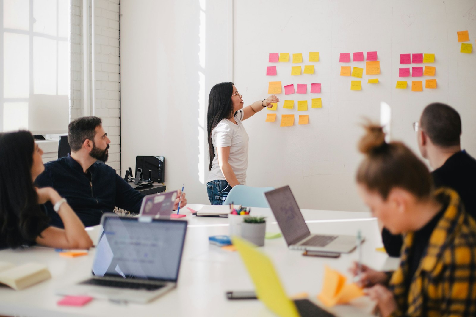 A team planning an MVP development process in front of a whiteboard